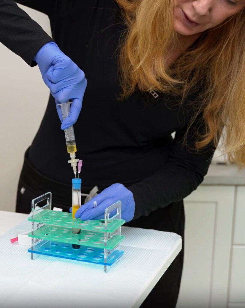Platelet rich plasma tubes being prepared with a pipette during training
