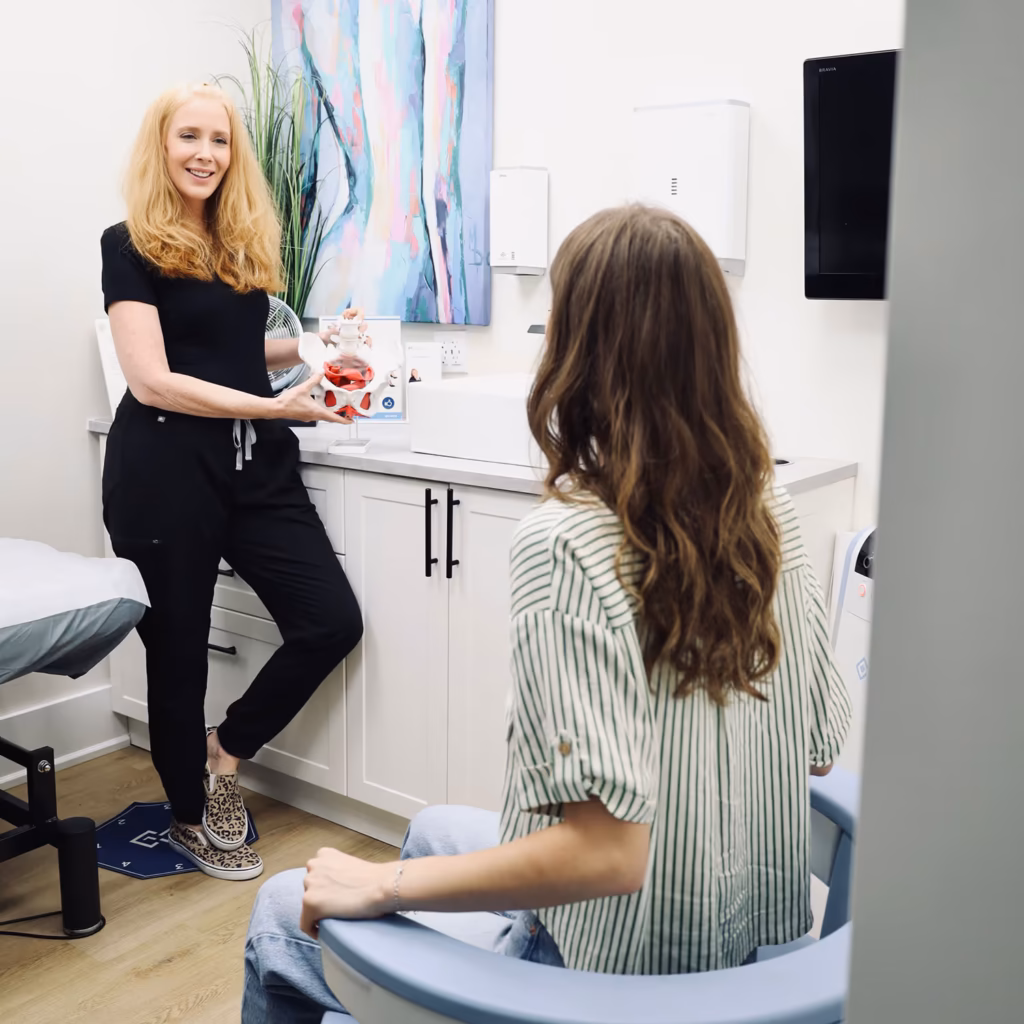 A practitioner talking with a patient during a hormone therapy consultation