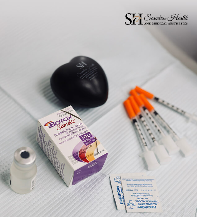 Vial, syringes and supplies laid out on a treatment tray before a session